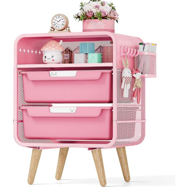 Pink metal nightstand with drawers, side storage basket, and wooden legs