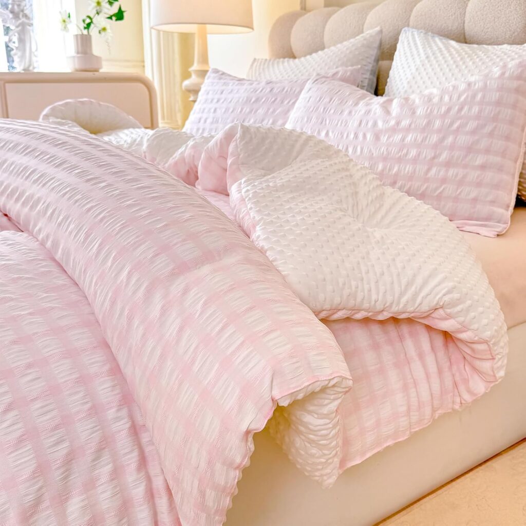 Blush pink jacquard seersucker comforter set with textured plaid design and matching pillowcases