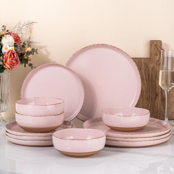 Cloud pink stoneware dinnerware set with handpainted plates and bowls featuring rustic terracotta undersides