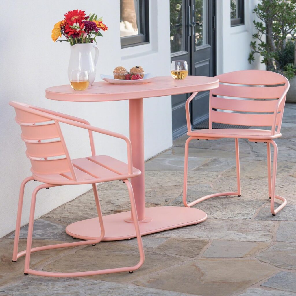 Matte coral outdoor bistro table and chair set with oval table and iron frame for patios and balconies