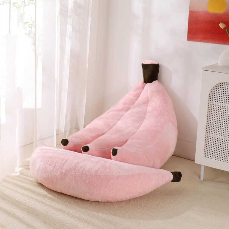 Pink banana-shaped bean bag chair with matching ottoman designed for lounging, gaming, and relaxing in bedrooms or dorm rooms