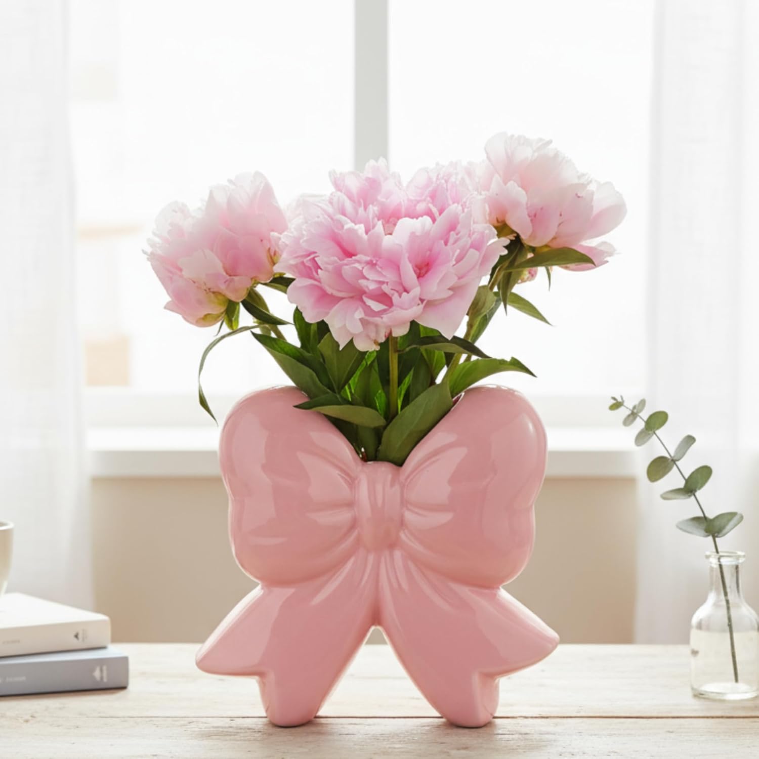 pink-bow-ceramic-vase-holder pink ceramic bow vase used as flower vase and makeup brush holder on vanity table