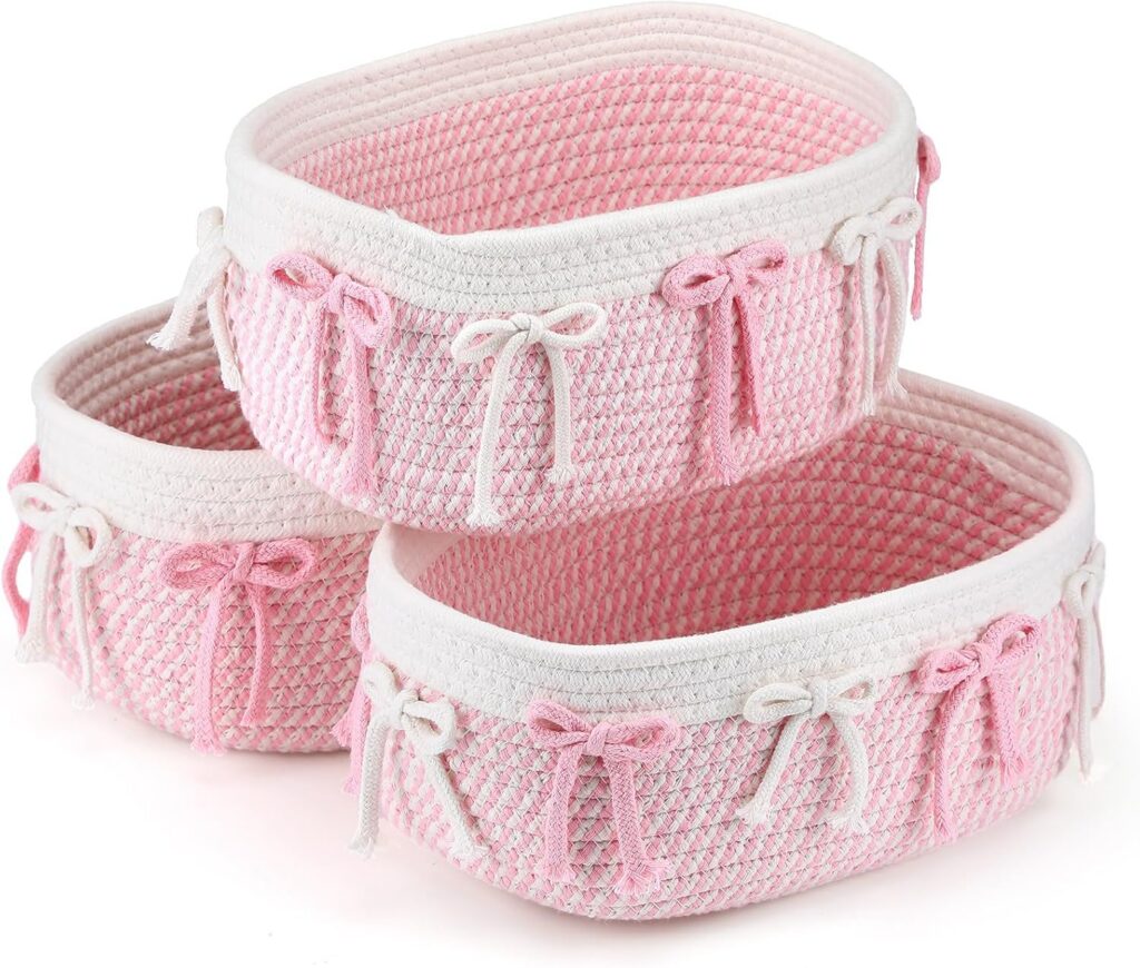 pink woven rope storage baskets with bow accents for closet nursery shelf and bedroom organization