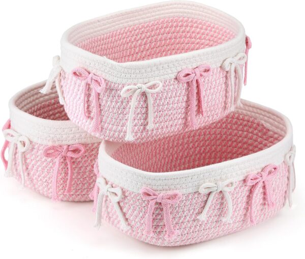 pink woven rope storage baskets with bow accents for closet nursery shelf and bedroom organization