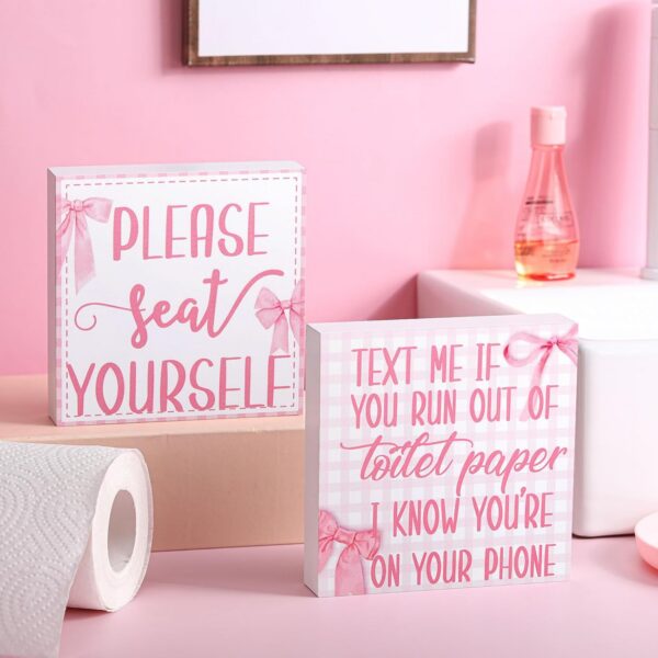 pink farmhouse bathroom wooden signs with funny toilet quotes and coquette decor style