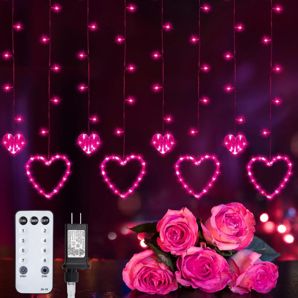 pink heart-shaped LED curtain fairy lights hanging on a bedroom window with romantic glowing ambiance