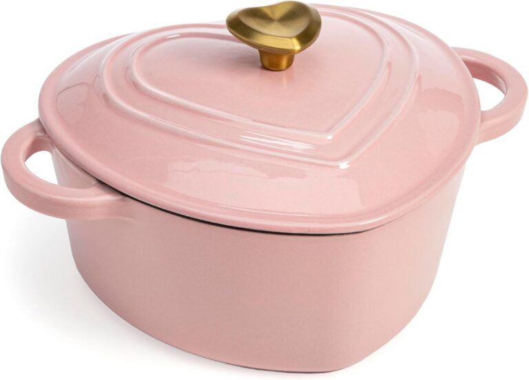 Pink heart-shaped enameled cast iron Dutch oven with gold heart knob and matching lid