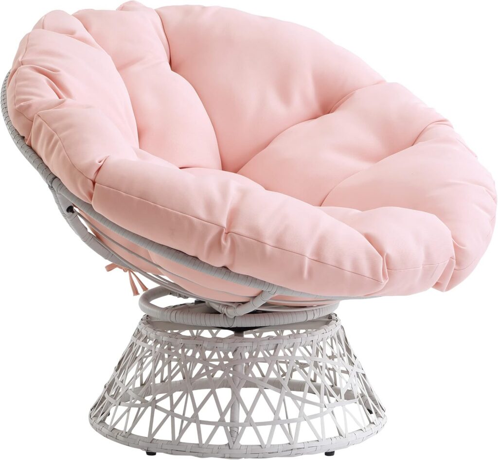 Bohemian papasan chair with cream wicker frame, pink tufted cushion, and swivel base