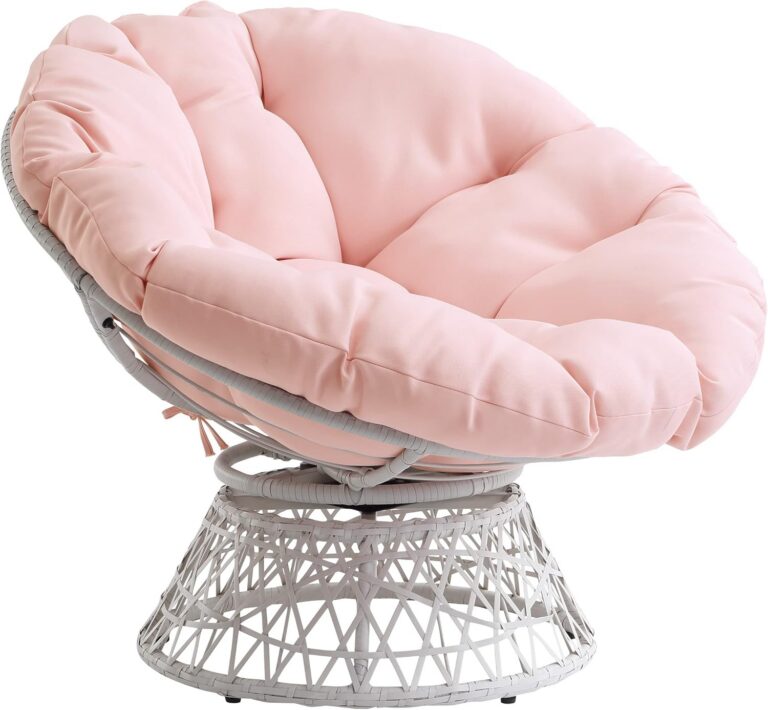 Bohemian papasan chair with cream wicker frame, pink tufted cushion, and swivel base