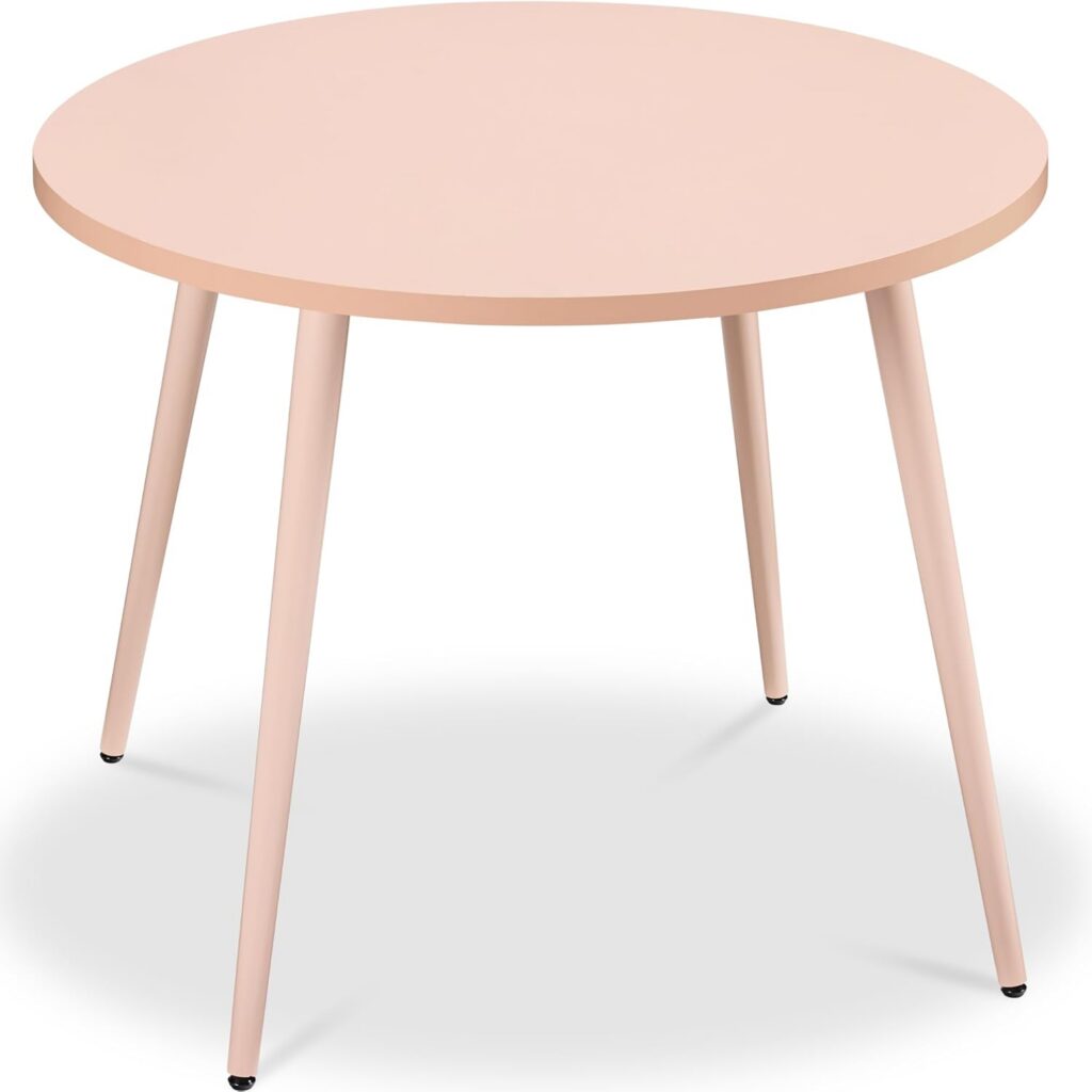 pink round mid-century modern dining table with tapered steel legs for small dining spaces