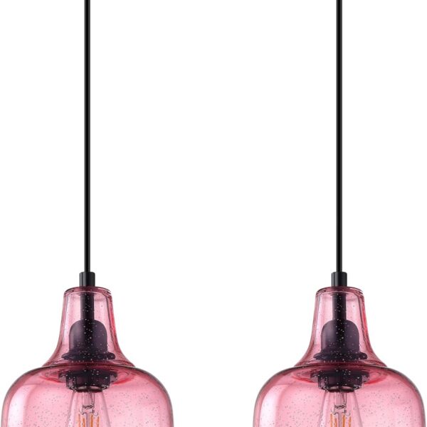 Pink seeded glass pendant ceiling lights with black finish hanging above a kitchen island