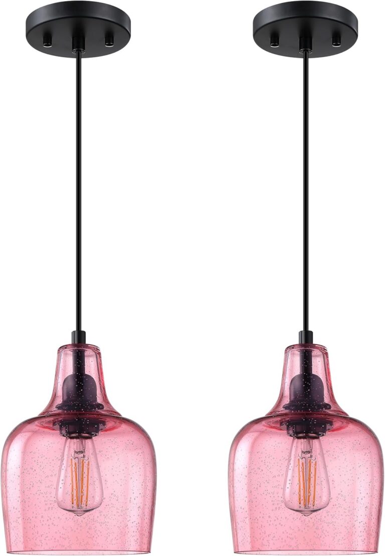 Pink seeded glass pendant ceiling lights with black finish hanging above a kitchen island