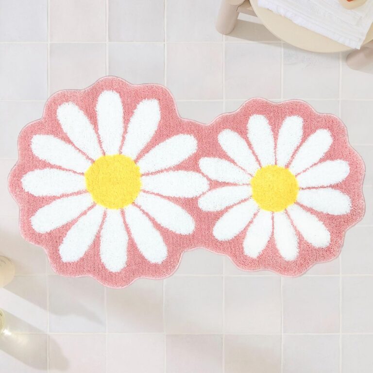 Pink and white daisy flower bath rug with soft high-pile microfiber fibers, non-slip backing, and absorbent construction designed for bathrooms, bedrooms, vanity areas, and preppy floral room décor.