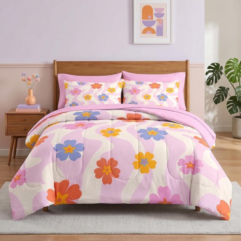 Juicy Couture queen/full reversible comforter set featuring pink and white cabana stripes with matching pillow shams and three decorative accent pillows for glamorous bedroom décor.