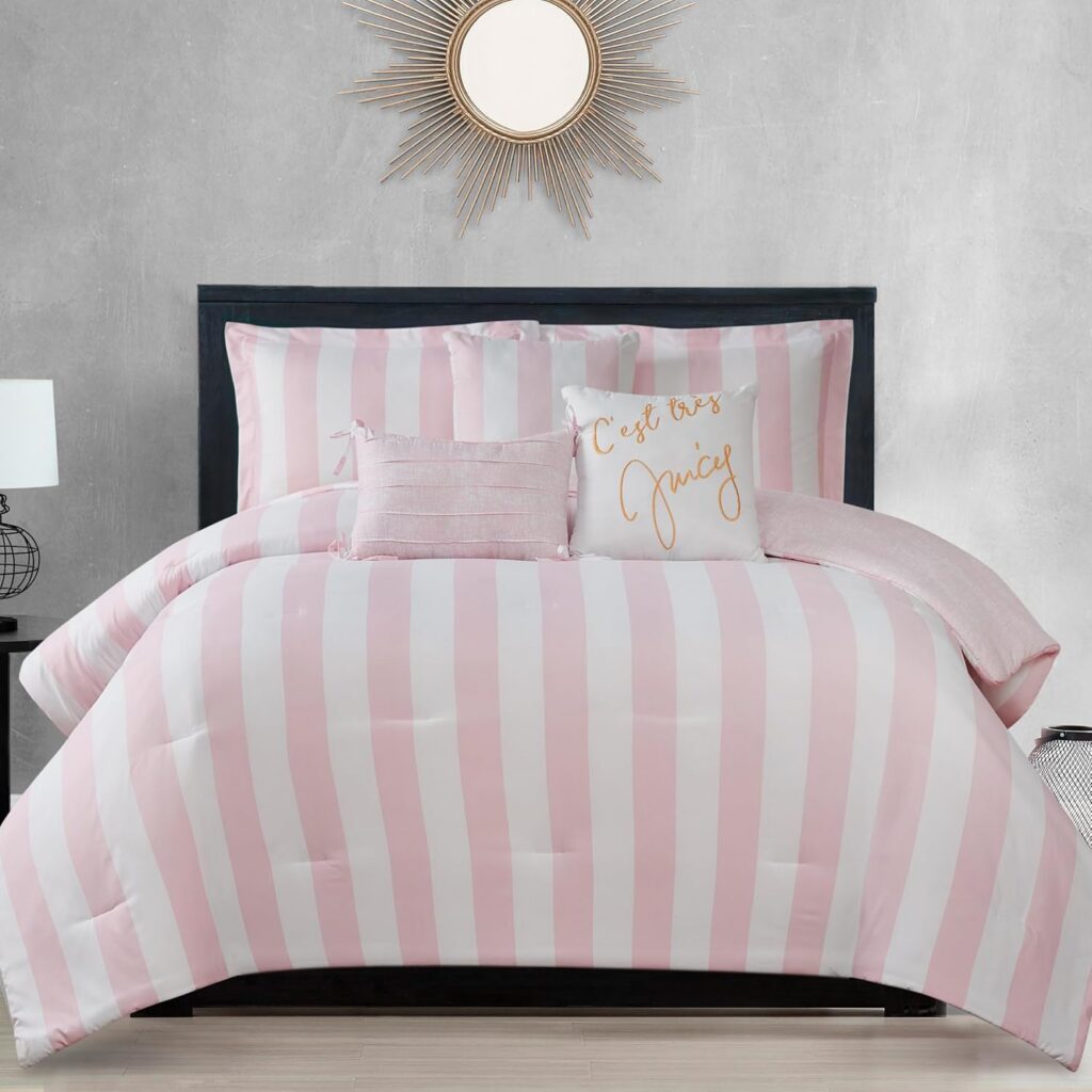 Juicy Couture queen/full reversible comforter set featuring pink and white cabana stripes with matching pillow shams and three decorative accent pillows for glamorous bedroom décor.