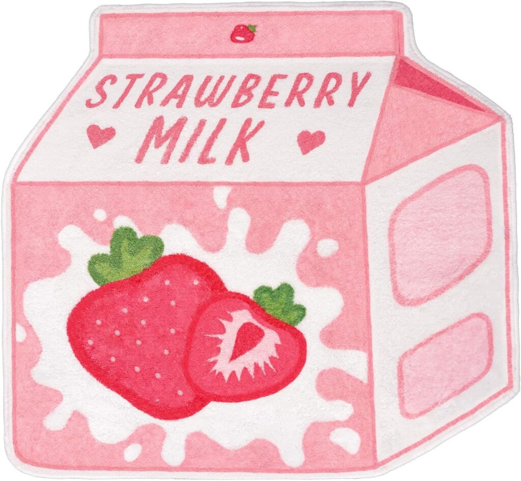 Cute pink strawberry milk bath mat with soft plush microfiber pile, absorbent surface, and non-slip rubber backing, designed as a playful decorative rug for bathrooms, bedrooms, dorm rooms, and kawaii-inspired spaces.