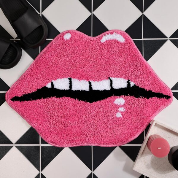 Pink lips-shaped plush bath mat with soft microfiber pile, absorbent surface, and non-slip backing, designed as a fun decorative bathroom rug for feminine, coquette, and playful room décor.