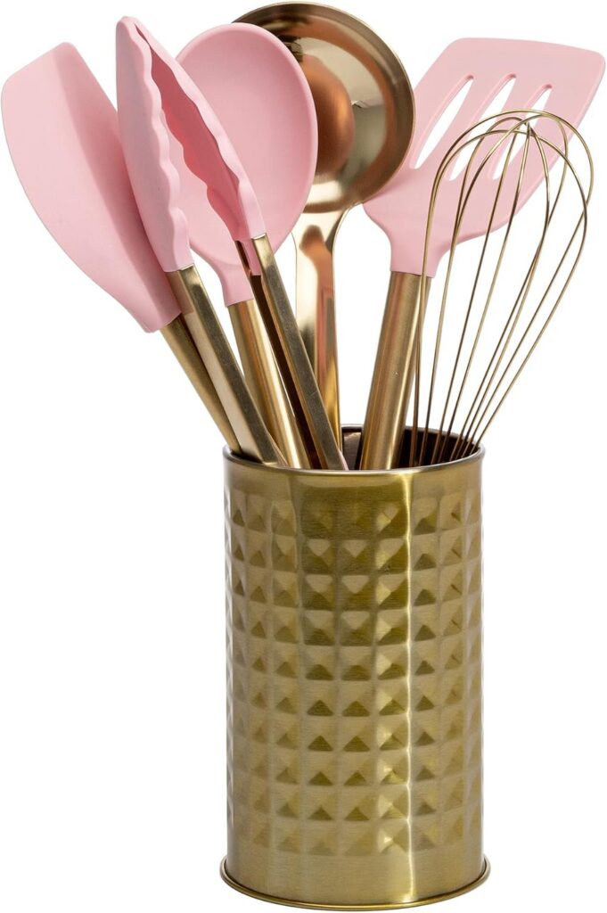 Pink and gold Paris Hilton kitchen utensil set featuring silicone cooking tools, stainless steel whisk and ladle, and a matching countertop tool crock for stylish kitchen organization.