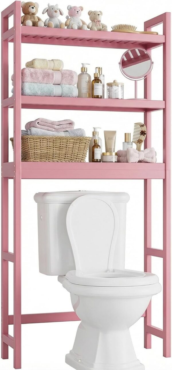 Pink freestanding bamboo over-the-toilet storage shelf with three adjustable open shelves, designed to organize towels, toiletries, toilet paper, and bathroom essentials while maximizing vertical storage space.