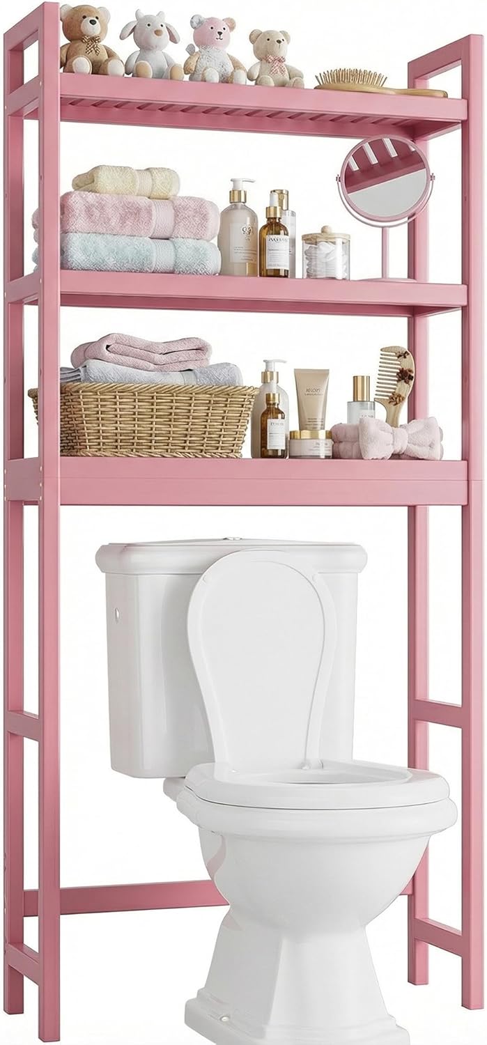Pink freestanding bamboo over-the-toilet storage shelf with three adjustable open shelves, designed to organize towels, toiletries, toilet paper, and bathroom essentials while maximizing vertical storage space.