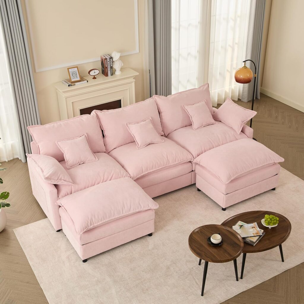 Modern pink modular U-shaped chenille cloud sectional sofa with extra-deep seating, movable ottoman, removable cushions, and plush foam padding for stylish living room décor.