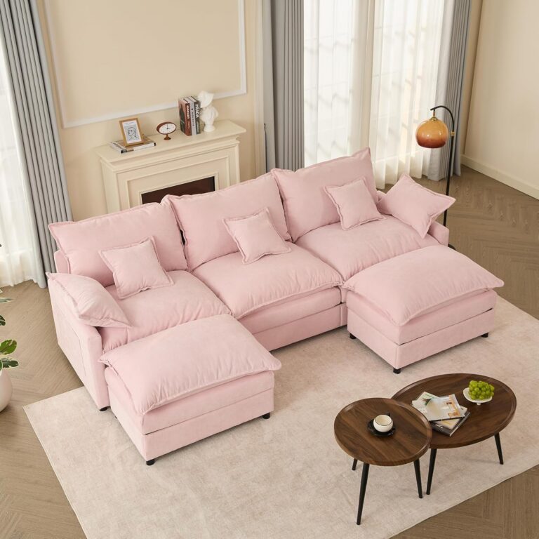 Modern pink modular U-shaped chenille cloud sectional sofa with extra-deep seating, movable ottoman, removable cushions, and plush foam padding for stylish living room décor.