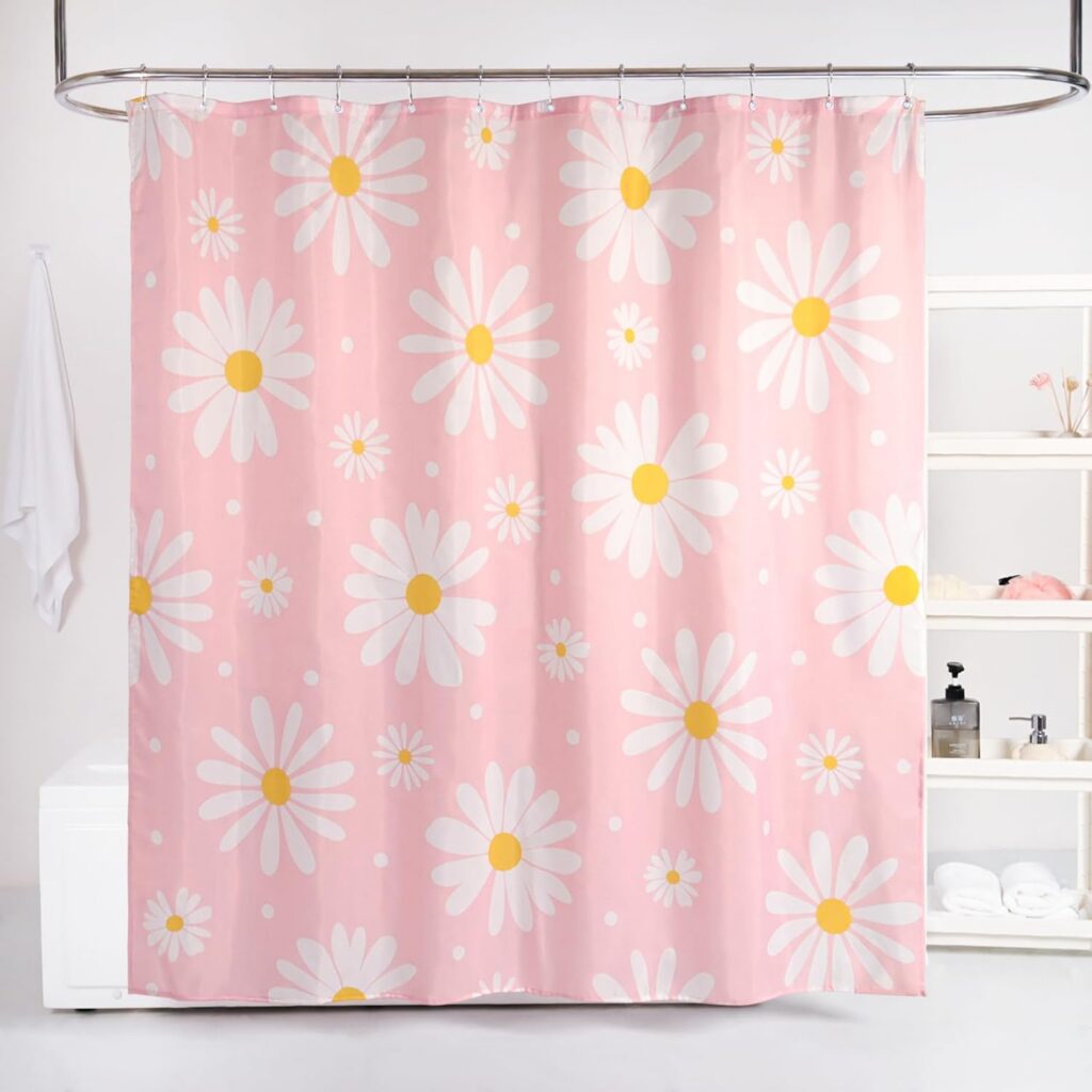 Pink floral shower curtain featuring white daisy flowers on waterproof polyester fabric with reinforced grommets, weighted hem, and 12 stainless steel hooks for a cute girly bathroom décor aesthetic.
