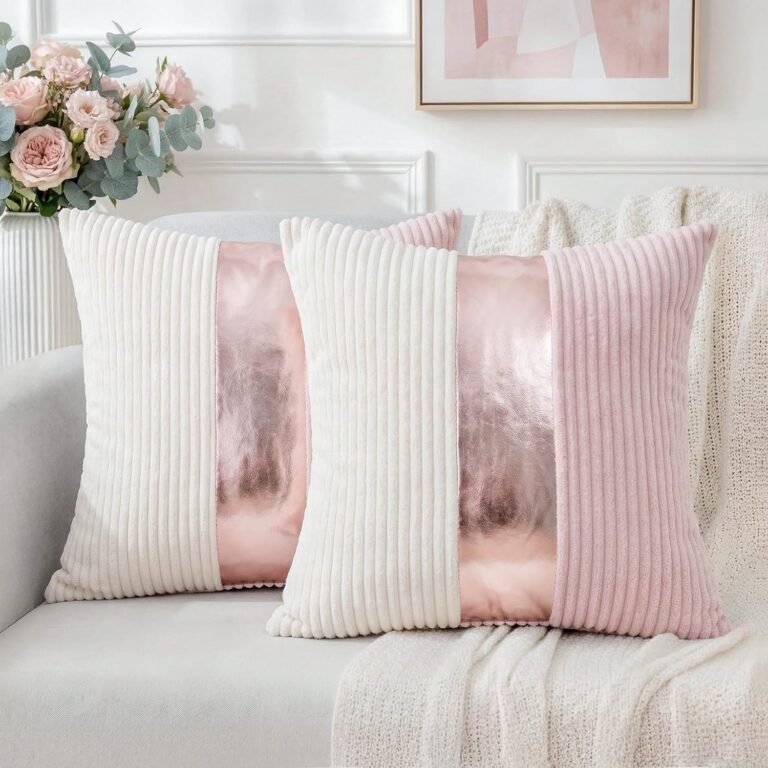 Set of two pink and cream striped corduroy throw pillow covers with gold faux leather patchwork, reversible decorative cushion covers for couches, sofas, and living rooms.