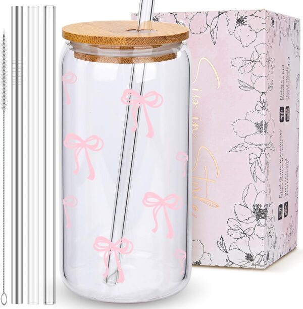 BIPEDS 16-ounce coquette glass tumbler featuring a pink bow design with a bamboo lid, three reusable straws, and a cleaning brush for iced coffee, matcha, tea, and other beverages.