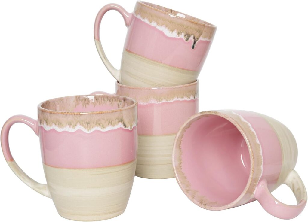 Set of four pink 17-ounce ceramic coffee mugs with a unique reactive glaze finish, large comfortable handles, and microwave- and dishwasher-safe construction for coffee, tea, and other hot beverages.