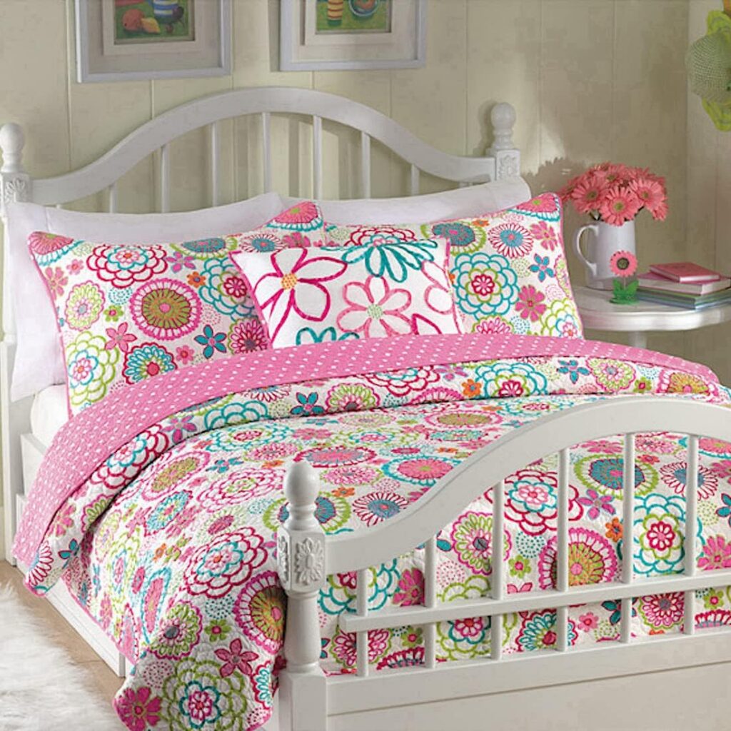 Pink Mariah twin reversible quilt bedding set with a floral and polka dot design, including a microfiber quilt and matching standard pillow sham for year-round bedroom comfort.