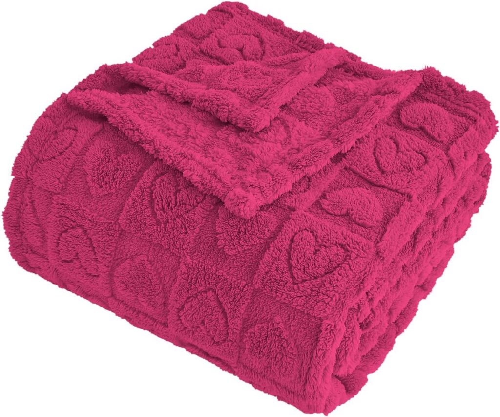Hot pink microfiber throw blanket featuring a heart checkered pattern with a soft fluffy texture, designed for couches, beds, sofas, and cozy year-round home décor.