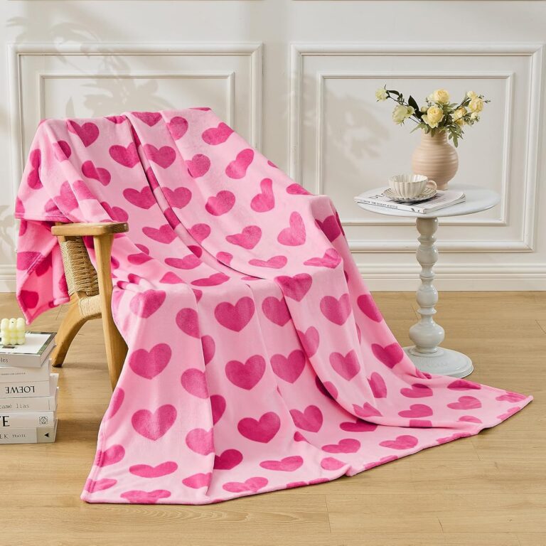 Hot pink flannel throw blanket with a classic heart pattern made from ultra-soft 280 GSM microfiber polyester, designed for cozy year-round comfort on beds, couches, and sofas.