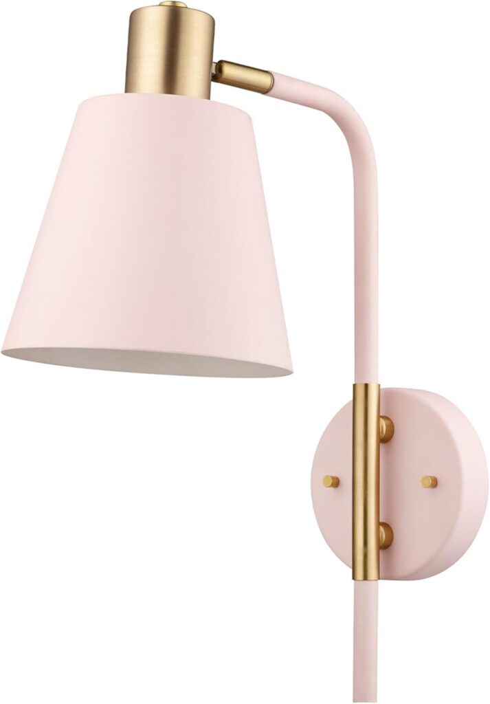 Blush pink metal wall sconce with matte brass accents and a black cloth cord, featuring plug-in or hardwired installation for stylish accent lighting in bedrooms, living rooms, and hallways.
