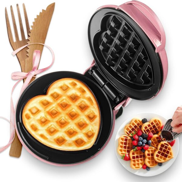 Compact pink mini heart-shaped waffle maker with 4-inch nonstick cooking plates for waffles, paninis, hash browns, and other quick breakfast recipes.