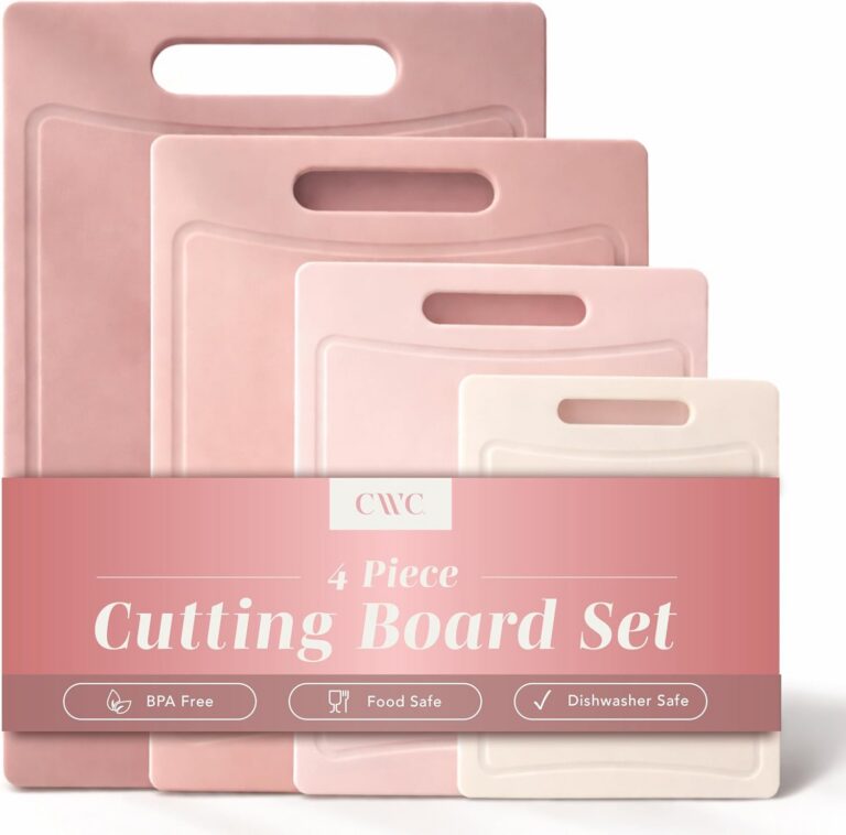 Set of four pink BPA-free plastic cutting boards with non-slip rubber feet and built-in easy-grip handles in assorted sizes for chopping meat, vegetables, fruit, cheese, and fish.