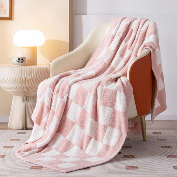 Light pink reversible checkered microfiber knit throw blanket with a soft velvety texture for couches, beds, sofas, dorm rooms, and modern home décor.