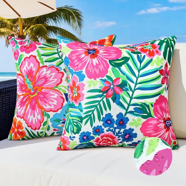 Set of two 18 x 18 inch waterproof outdoor pillow covers featuring vibrant pink tropical flowers, green botanical leaves, double-sided printing, and hidden zipper closures for patio furniture, balconies, and garden seating.
