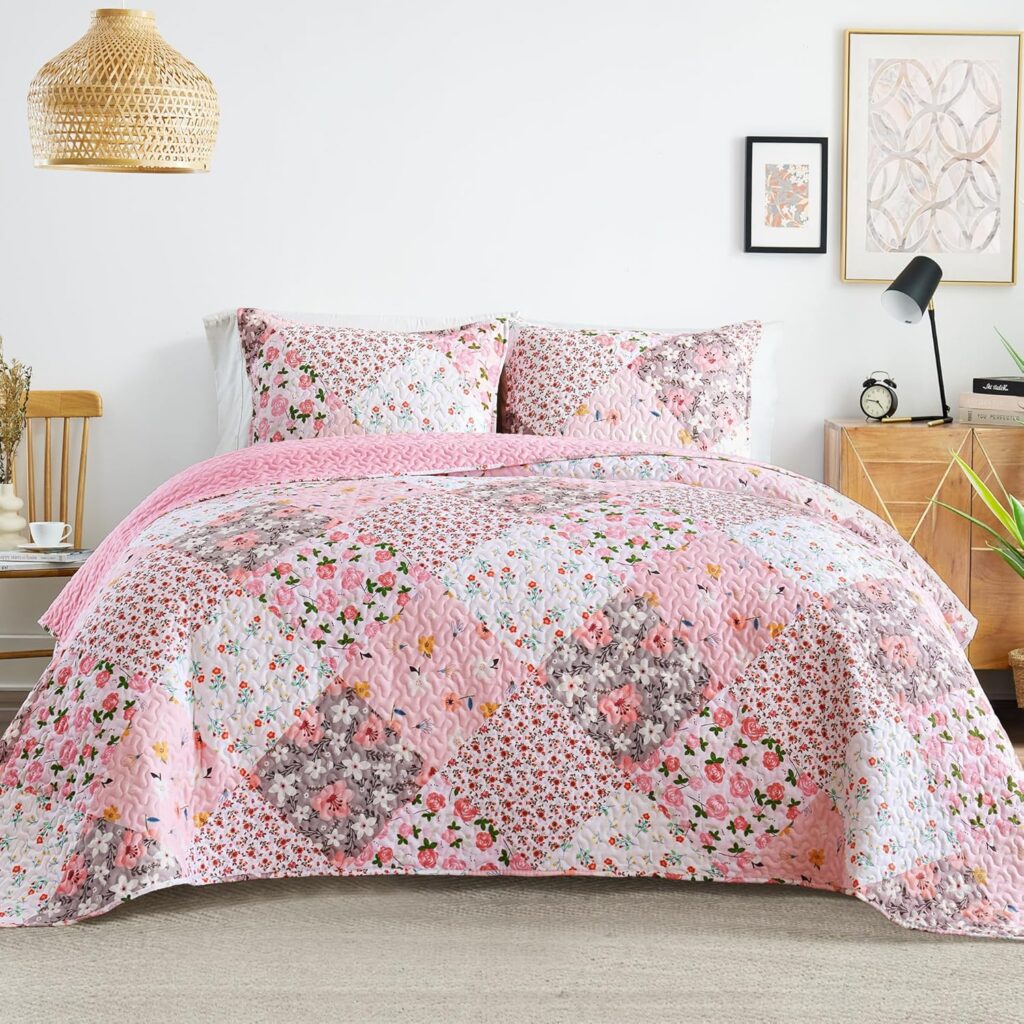 Whale Flotilla pink floral patchwork quilt set with a reversible microfiber quilt and two matching pillow shams for full and queen beds.
