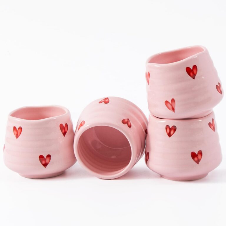 Set of four pink Japanese-style ceramic tea cups with red heart patterns, featuring a handless 5-ounce design for espresso, matcha, tea, and other small hot beverages.