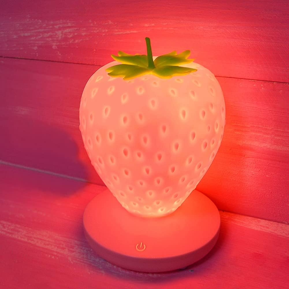 Cute pink silicone strawberry LED night light with touch controls, three brightness modes, and USB rechargeable design for bedrooms and nurseries.